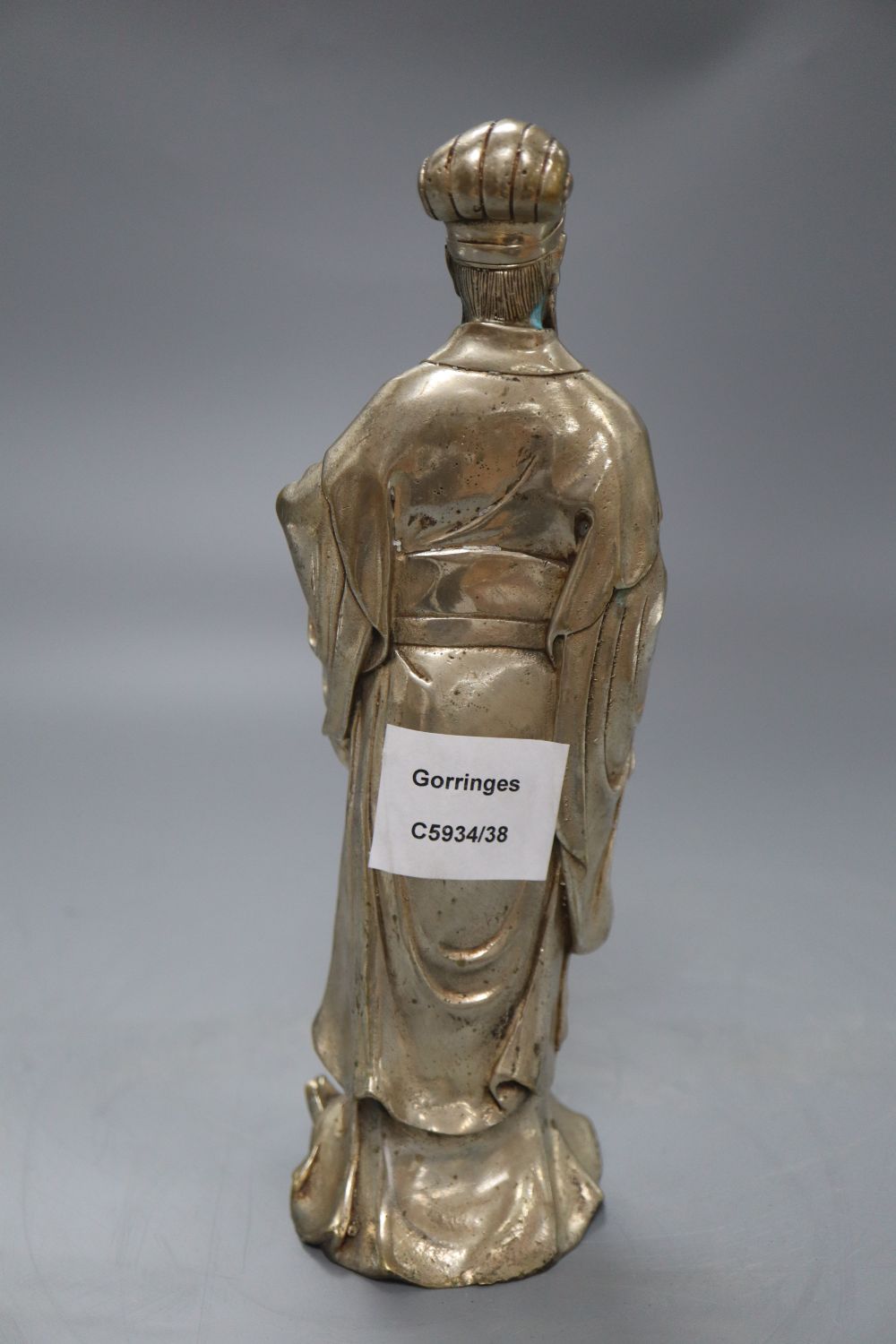 A Chinese silvered metal figure of an elder, height 24cm